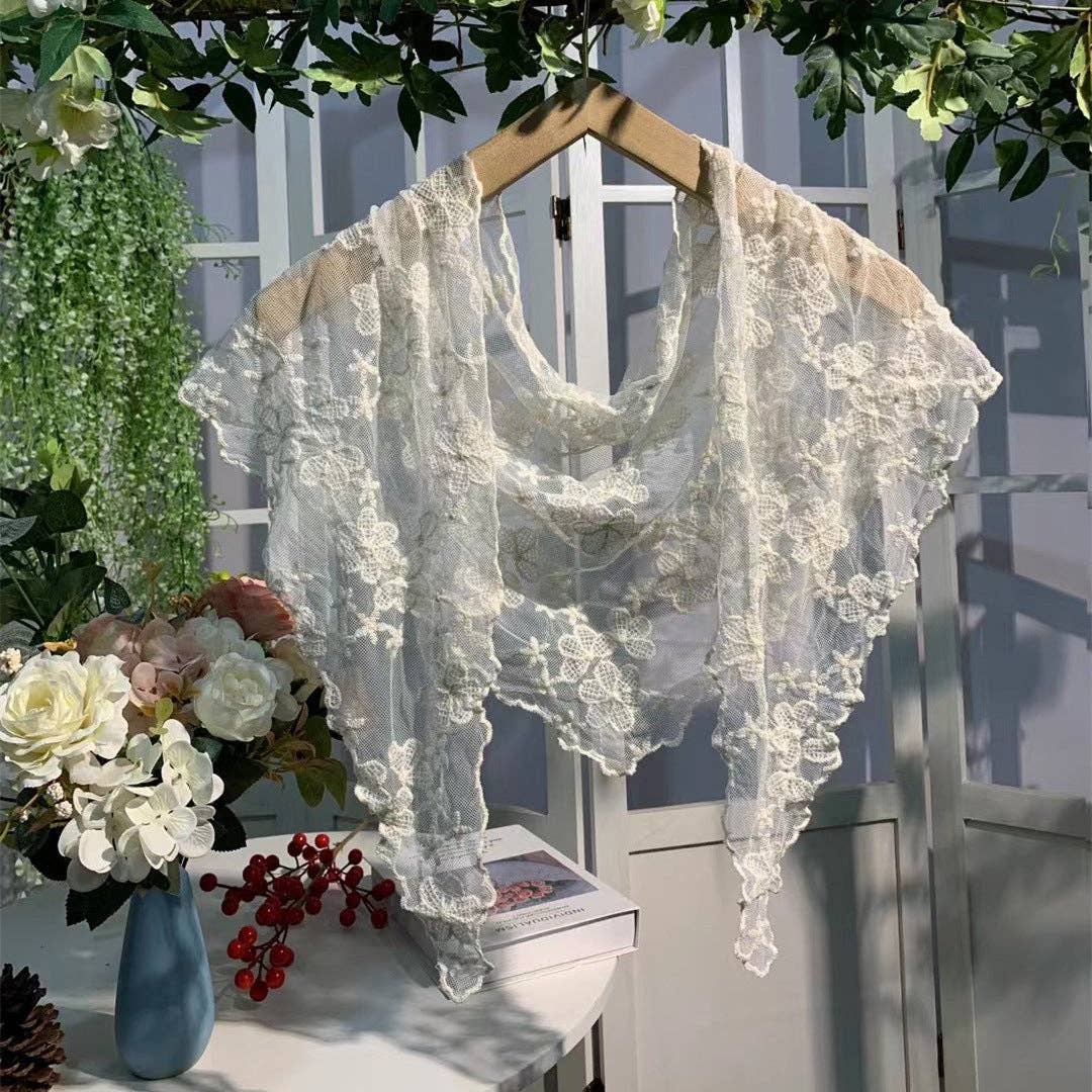 Embroidered floral lace shawl or shrug featuring a romantic heroine blossom design, perfect for elegant evening wear.
