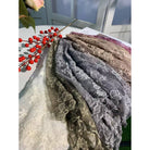 Embroidered floral lace shawl or shrug from The Bullish Store featuring delicate blossom patterns, perfect as a romantic accessory.