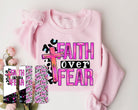 Faith Over Fear graphic tee by Anchored Grace Boutique, featuring a stylish design with inspiring text on a casual t-shirt.