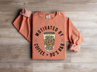 Graphic tee by Anchored Grace Boutique featuring a 90's R&B and coffee-inspired design, displayed on a hanger.