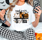 Graphic tee featuring "Read More Books" design by Anchored Grace Boutique, casual apparel for book lovers.