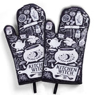 Set of 2 Kitchen Witch oven mitts and pot holders from The Bullish Store, hanging oven gloves with colorful witch design.