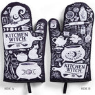 Set of 2 Kitchen Witch oven mitts and pot holders from The Bullish Store, hanging with colorful witch-themed designs.