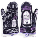 Set of 2 witch-themed oven mitts and pot holders from The Bullish Store, hanging for easy use in the kitchen.