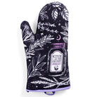 Set of 2 witch-themed oven mitts and pot holders from The Bullish Store, hanging with colorful fabric and Halloween design.