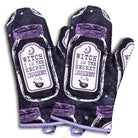 Set of 2 Halloween-themed oven mitts and pot holders with witch design from The Bullish Store, hanging and ready for use.