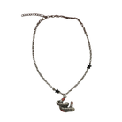 Sourpuss "Good Luck" horseshoe necklace with red rhinestones and black star charms, featuring a stylish and lucky jewelry design.