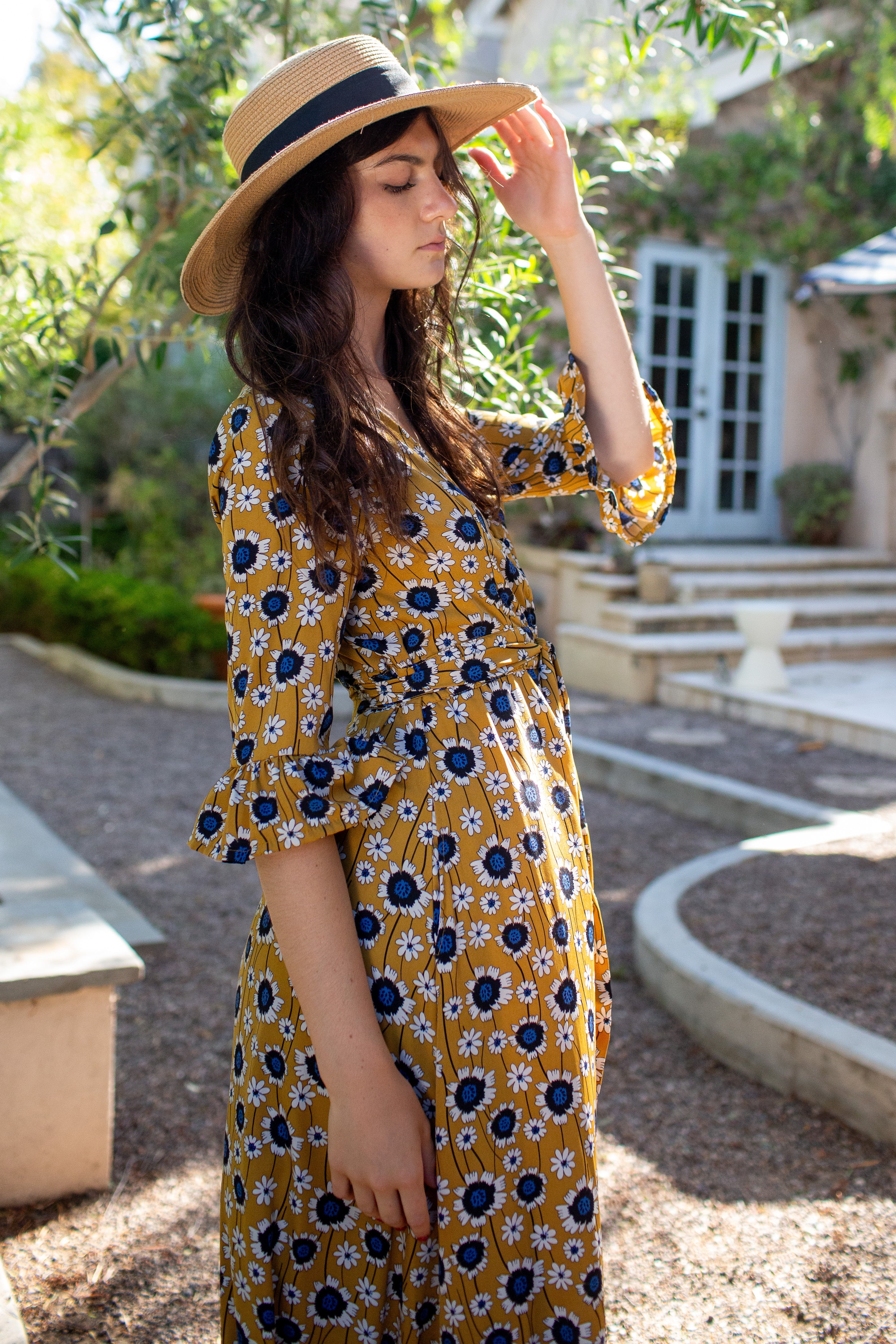 Gold sunflower-patterned dressing gown by Jennafer Grace, featuring a soft, flowing fabric and floral design for comfortable lounging.