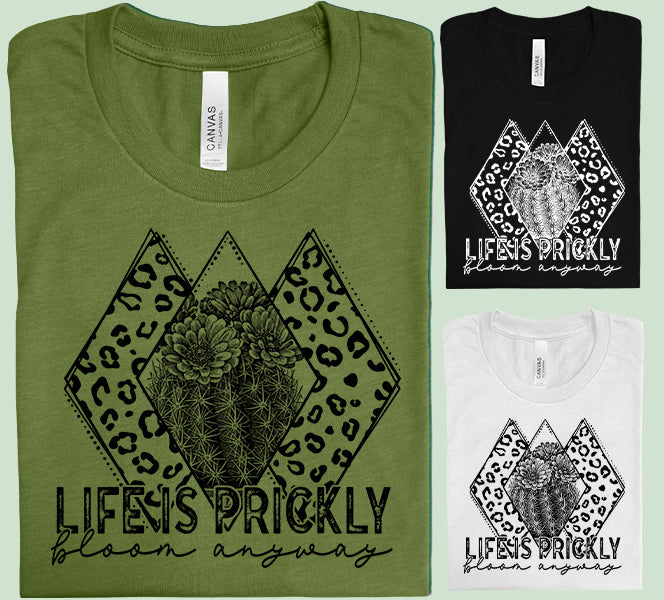 Life is Prickly Bloom Anyway graphic tee from Anchored Grace Boutique, featuring a colorful floral design on a casual cotton shirt.