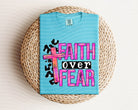 Faith Over Fear graphic tee by Anchored Grace Boutique, featuring bold lettering on a comfortable casual t-shirt.
