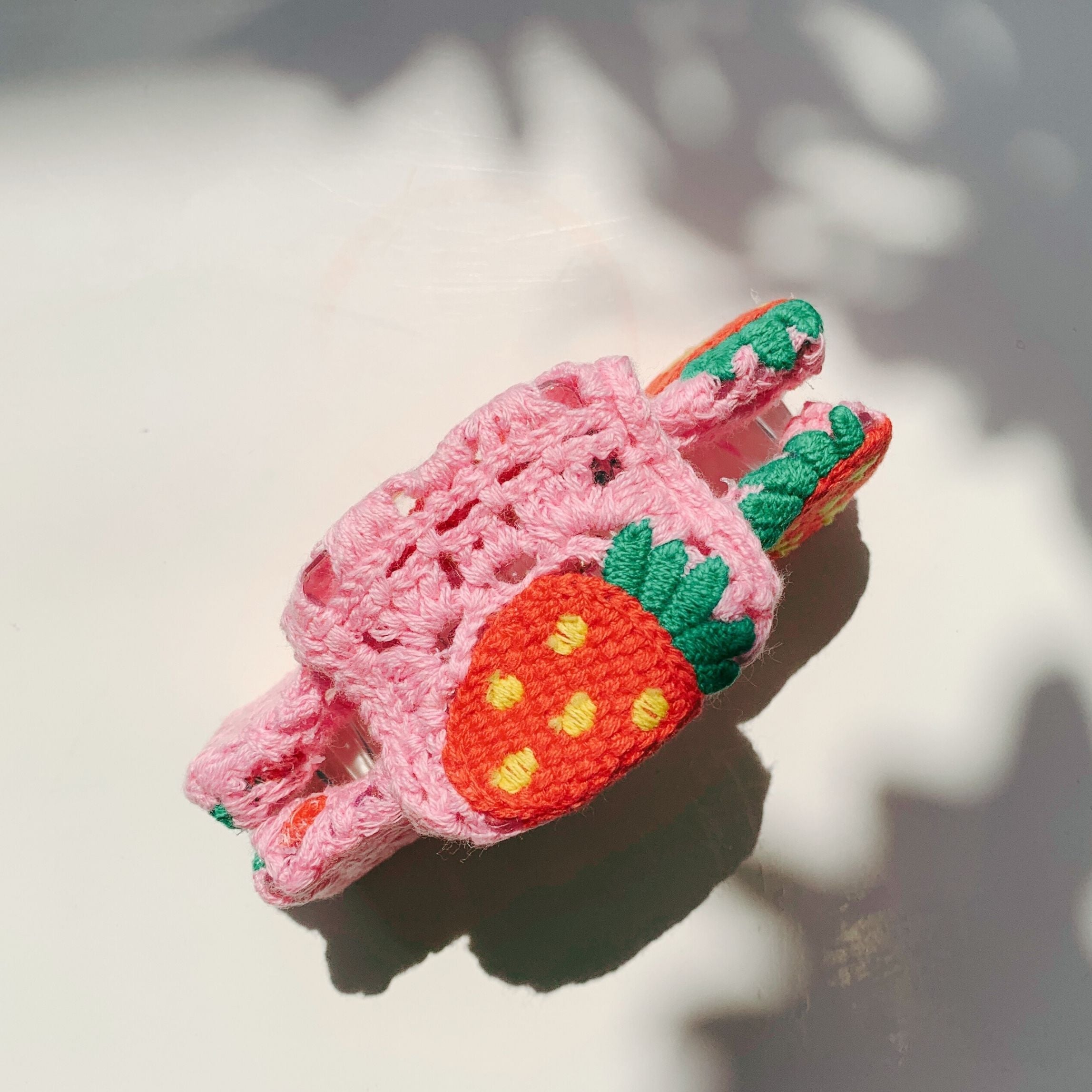 Velvet Claws Strawberry Granny Square hair claw from The Bullish Store, featuring a colorful crochet design for stylish hair accessories.