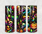 20 oz Neon Skulls skinny tumbler by Anchored Grace Boutique featuring colorful skull designs on a sleek stainless steel surface.