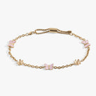 Gold stainless steel butterfly and flower anklet by ALEX AND ANI featuring delicate charms and adjustable chain.