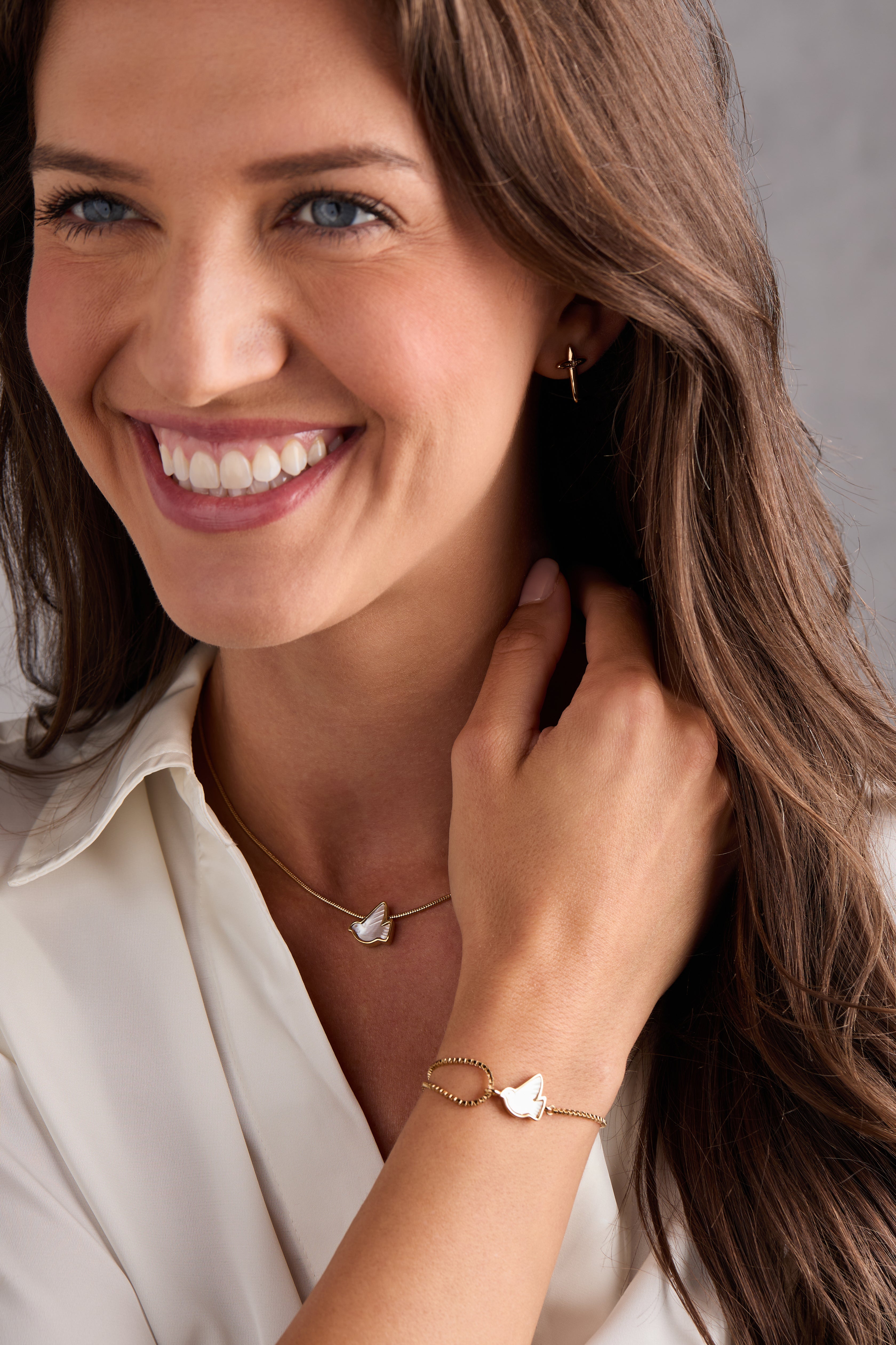 Gold ALEX AND ANI Dove 'Peace' Mother of Pearl pull chain bracelet featuring a dove charm and elegant design.