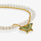 Gold bracelet featuring an emerald swallowtail butterfly charm from ALEX AND ANI, with intricate butterfly details and elegant design.