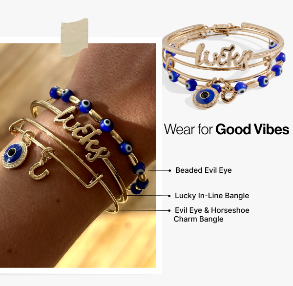 Set of three gold Evil Eye bangles by ALEX AND ANI featuring protective eye charms on sleek bracelets.