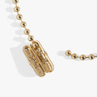Gold Evil Eye Barrel Closure Bracelet by ALEX AND ANI featuring a protective eye charm and smooth barrel closure.