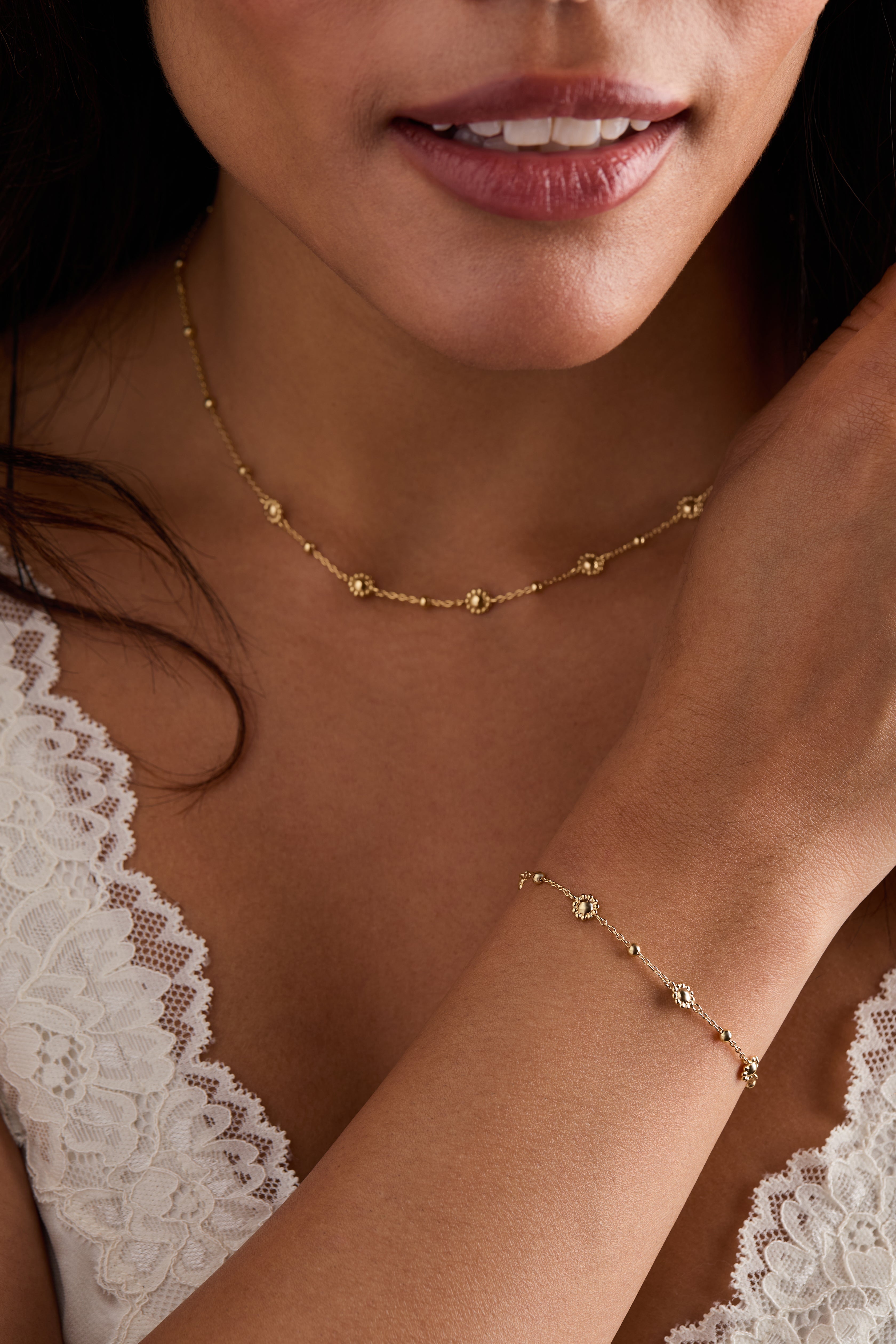 Gold Floret Chain Bracelet by ALEX AND ANI featuring delicate floral links and intricate chain design.
