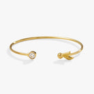 Gold Harry Potter™ Golden Snitch bracelet with crystal flex cuff by ALEX AND ANI, featuring intricate design and shimmering accents.