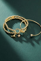 Gold Harry Potter™ Golden Snitch and Crystal Flex Cuff bracelet by ALEX AND ANI with intricate detailing and shimmering accents.