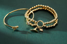 Gold Harry Potter Golden Snitch bracelet with crystal Flex Cuff by ALEX AND ANI, featuring intricate details and a sleek design.