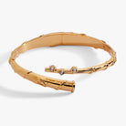 Gold Harry Potter Hermione Wand Bypass Cuff bracelet by ALEX AND ANI featuring a wand design and elegant gold finish.