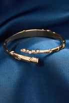 Gold Harry Potter Hermione Wand Bypass Cuff bracelet by ALEX AND ANI featuring wand design and sleek bracelet style.