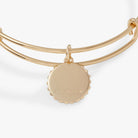 Gold Harry Potter Hufflepuff House charm bangle by ALEX AND ANI featuring a detailed Hufflepuff crest and decorative charms.