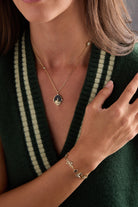 Gold Harry Potter™ Mixed Icon Inline Charm Bracelet by ALEX AND ANI featuring magical symbols and charms on a stylish bracelet.