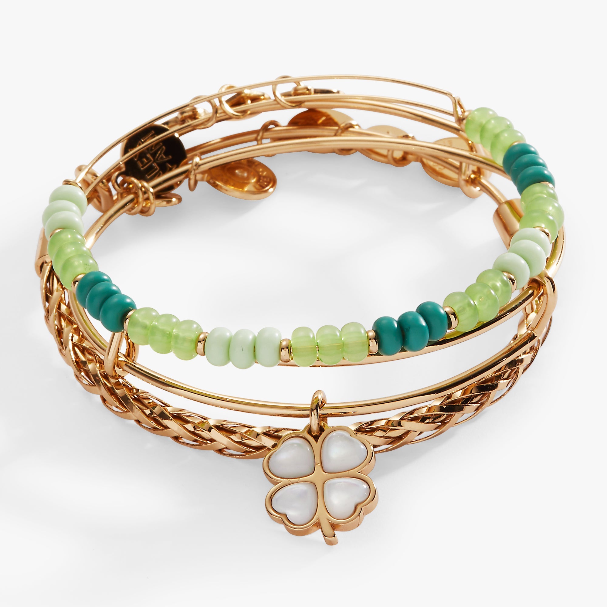 Set of three gold ALEX AND ANI Lucky Four-Leaf Clover bracelets featuring delicate clover charms and adjustable bangles.