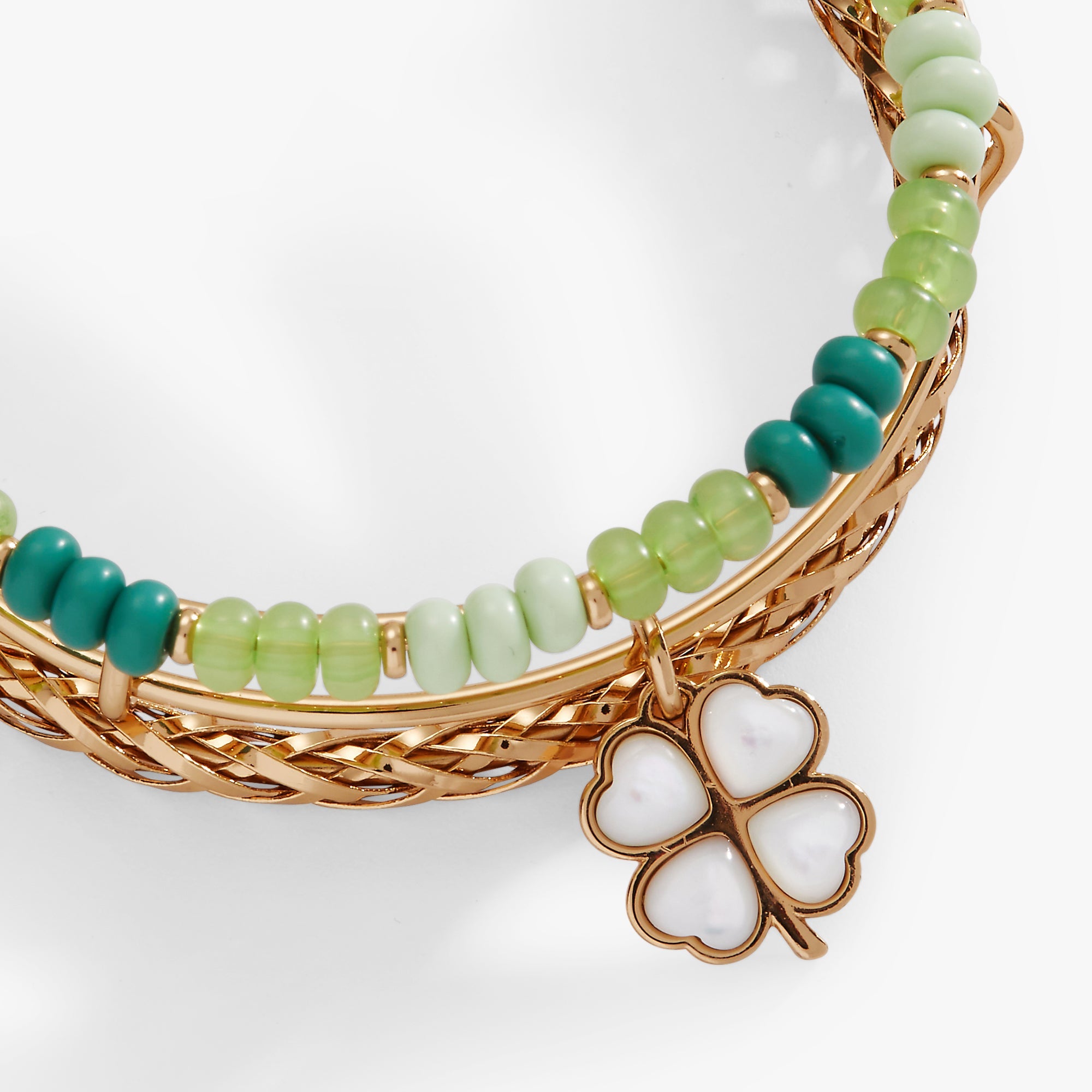 Gold ALEX AND ANI Lucky Four-Leaf Clover bracelet set of 3 bangles, featuring engraved four-leaf clover charms.