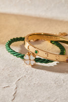 Gold Lucky Hinge Bangle bracelet by ALEX AND ANI featuring a smooth, hinged design and subtle decorative details.