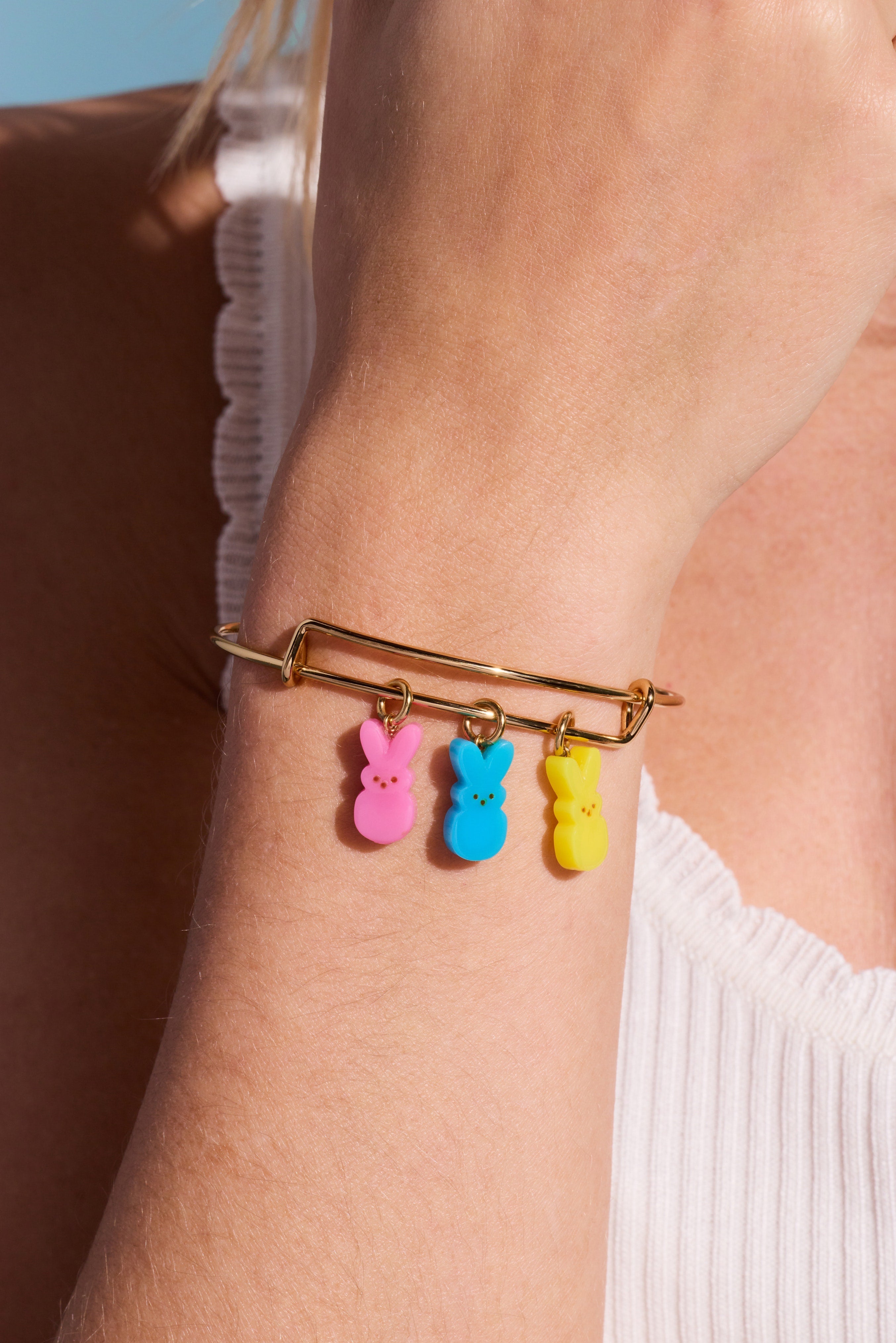 Gold PEEPS® Bunny multi-charm bangle bracelet by ALEX AND ANI featuring colorful bunny charms on a sleek gold band.