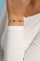 Gold PEEPS® Chick Bolo bracelet by ALEX AND ANI featuring a charming chick charm and adjustable cord for a stylish look.