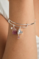 Gold ALEX AND ANI Spill the Tea bracelet featuring a cup and tea bag charm on a sleek bangle, stylish and charming jewelry accessory.