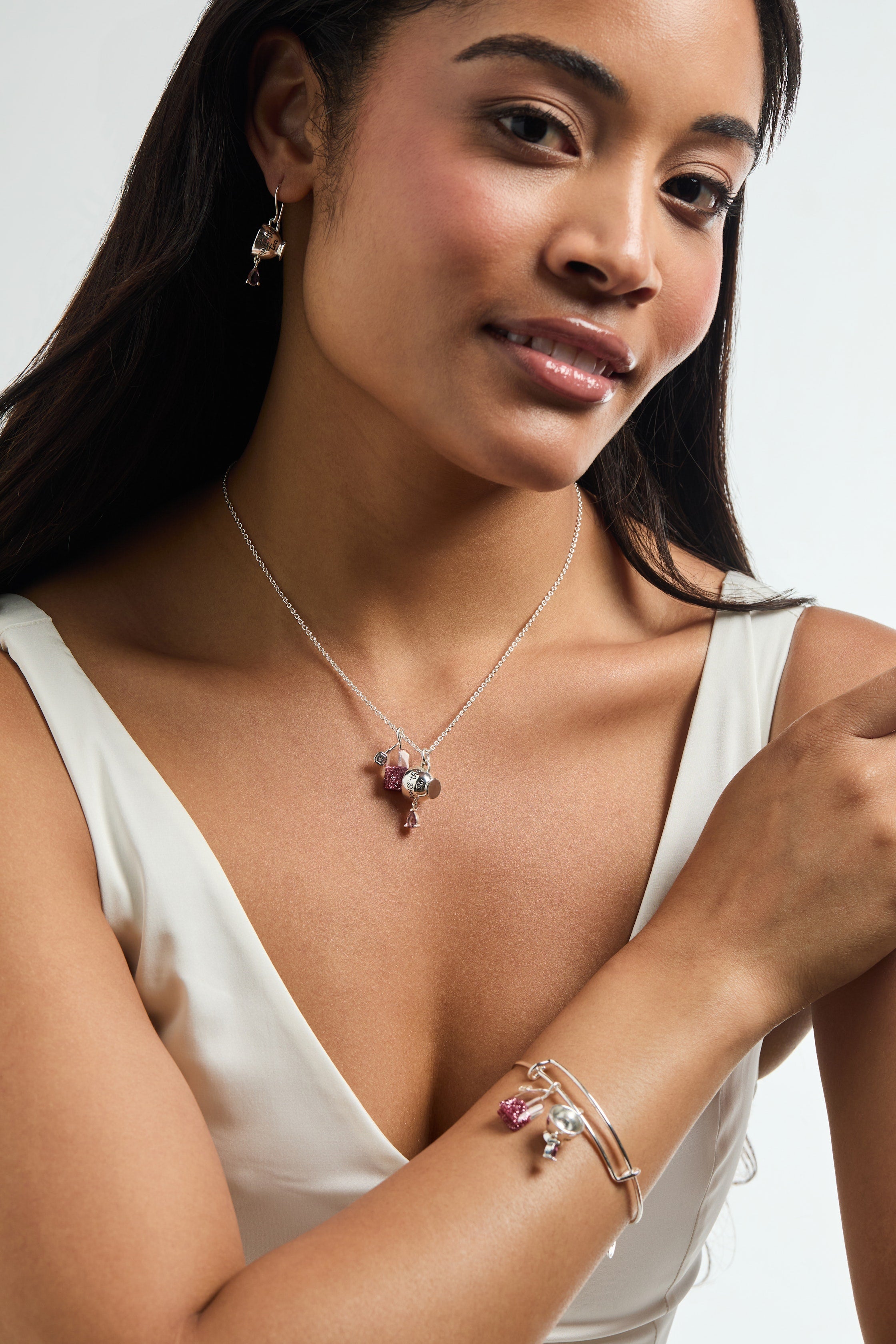 Gold ALEX AND ANI Spill the Tea bracelet featuring a cup and tea bag charm, stylish bangle jewelry with intricate detail.