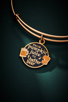 ALEX AND ANI Harry Potter charm bangle featuring Pumpkin Juice and Butter Beer motifs on a gold bracelet.