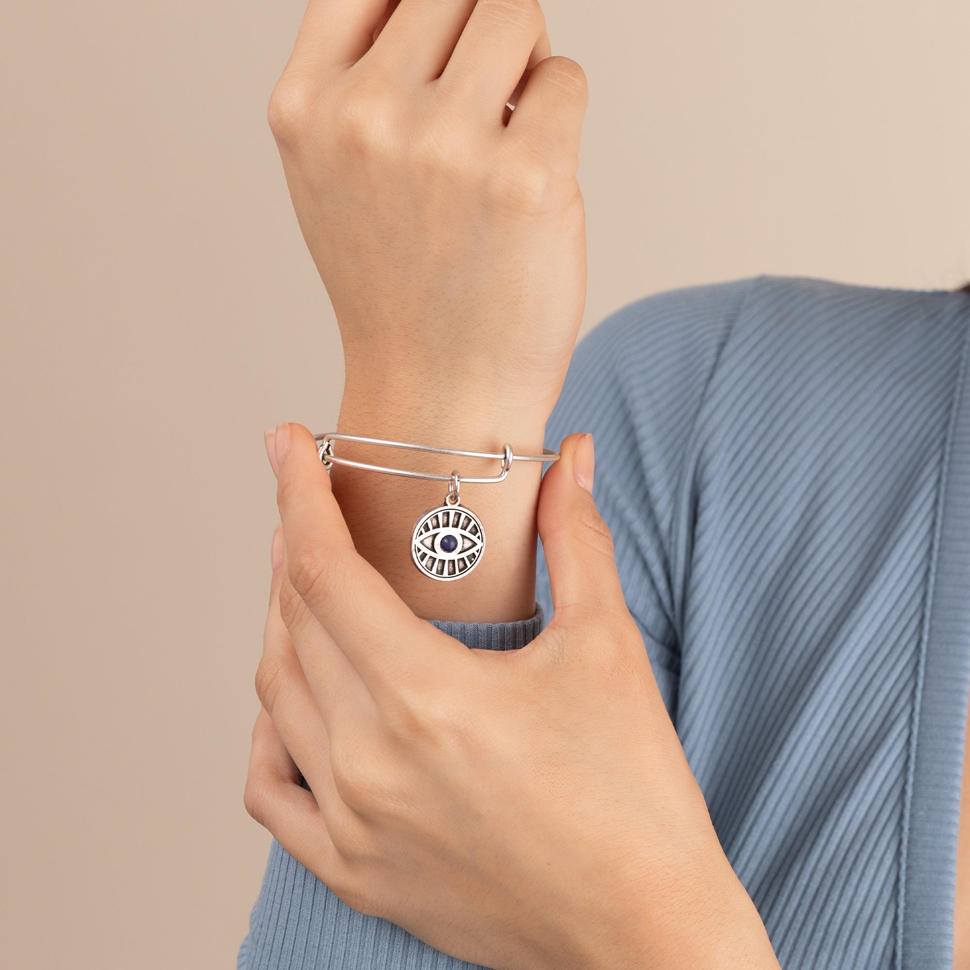 Silver Evil Eye and Sodalite Charm Bangle by ALEX AND ANI featuring a detailed bracelet with eye and gemstone charms.