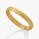 Satin gold Taurus Zodiac hinge bangle bracelet by ALEX AND ANI with engraved Taurus symbol and sleek design.