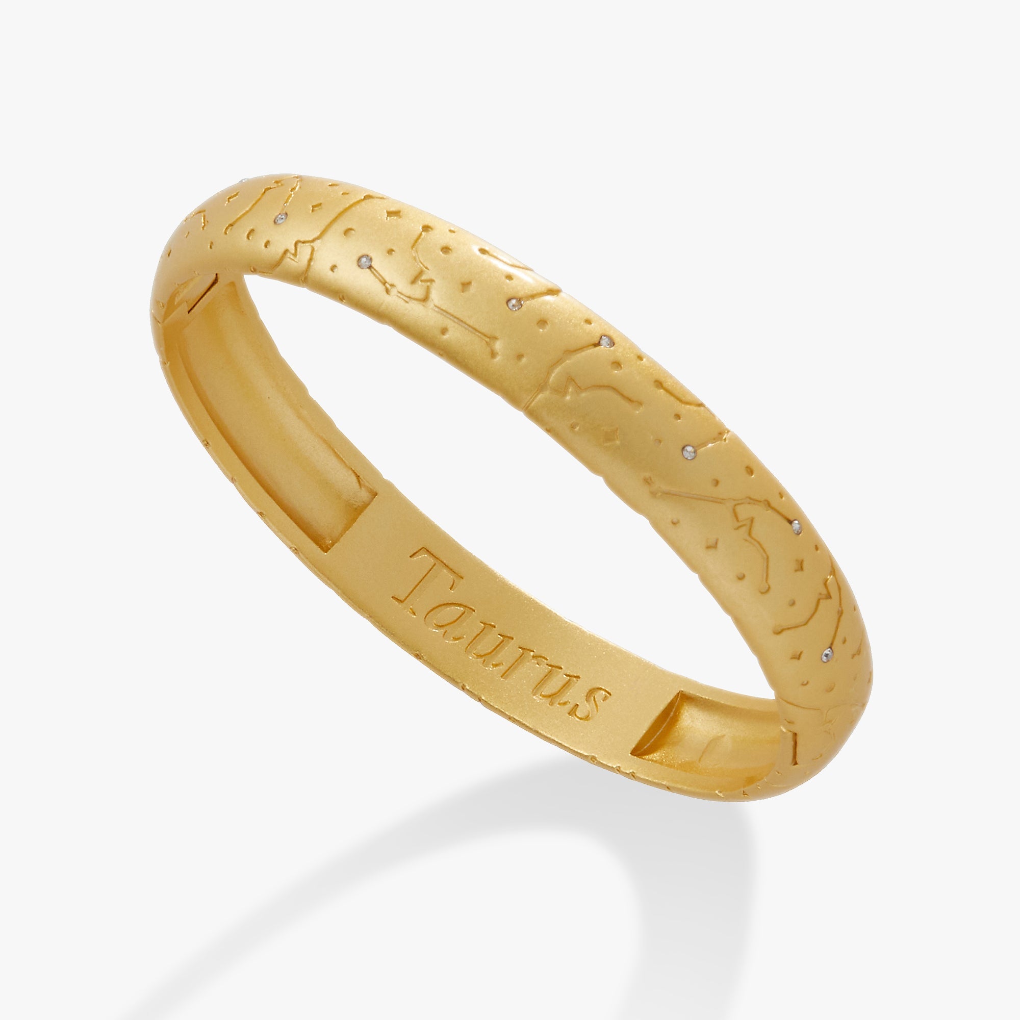 Satin gold Taurus Zodiac hinge bangle bracelet by ALEX AND ANI with engraved Taurus symbol and sleek design.