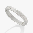 ALEX AND ANI Taurus Zodiac hinge bracelet with satin gold finish, featuring a Taurus symbol charm on a sleek bangle.