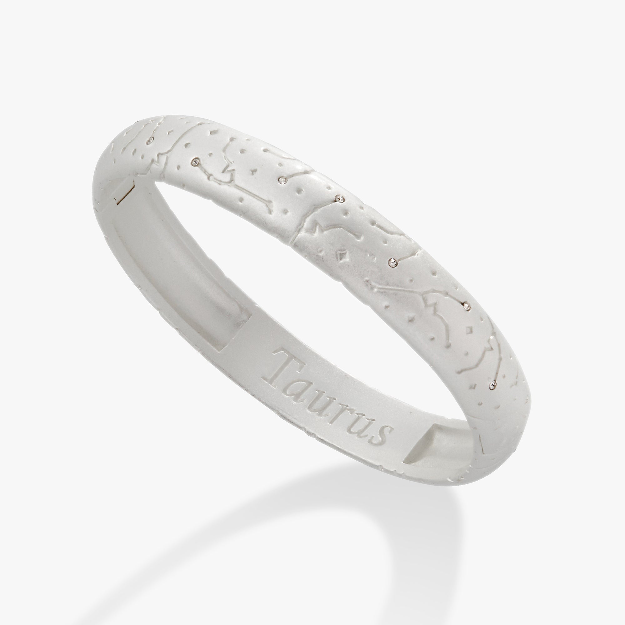 ALEX AND ANI Taurus Zodiac hinge bracelet with satin gold finish, featuring a Taurus symbol charm on a sleek bangle.