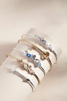 Silver Evil Eye Inline Bangle bracelet by ALEX AND ANI featuring a detailed evil eye charm on a sleek silver band.