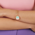 Silver Harry Potter Celebrate Cake Charm Bangle bracelet by ALEX AND ANI with detailed Harry Potter-themed charm design.