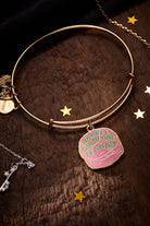 Silver Harry Potter Celebrate Cake Charm Bangle by ALEX AND ANI featuring a detailed Harry Potter-themed cake charm.