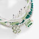 Set of five silver ALEX AND ANI lucky four-leaf clover bracelet bangles, featuring four-leaf clover charms in a jewelry image.