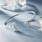 Silver Moon and Sun Flex Cuff bracelet by ALEX AND ANI featuring celestial designs and adjustable fit.