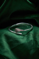 Silver The Wizard of Oz Wicked Witch Broom Bypass Cuff bracelet by ALEX AND ANI, featuring witch-themed design and intricate details.