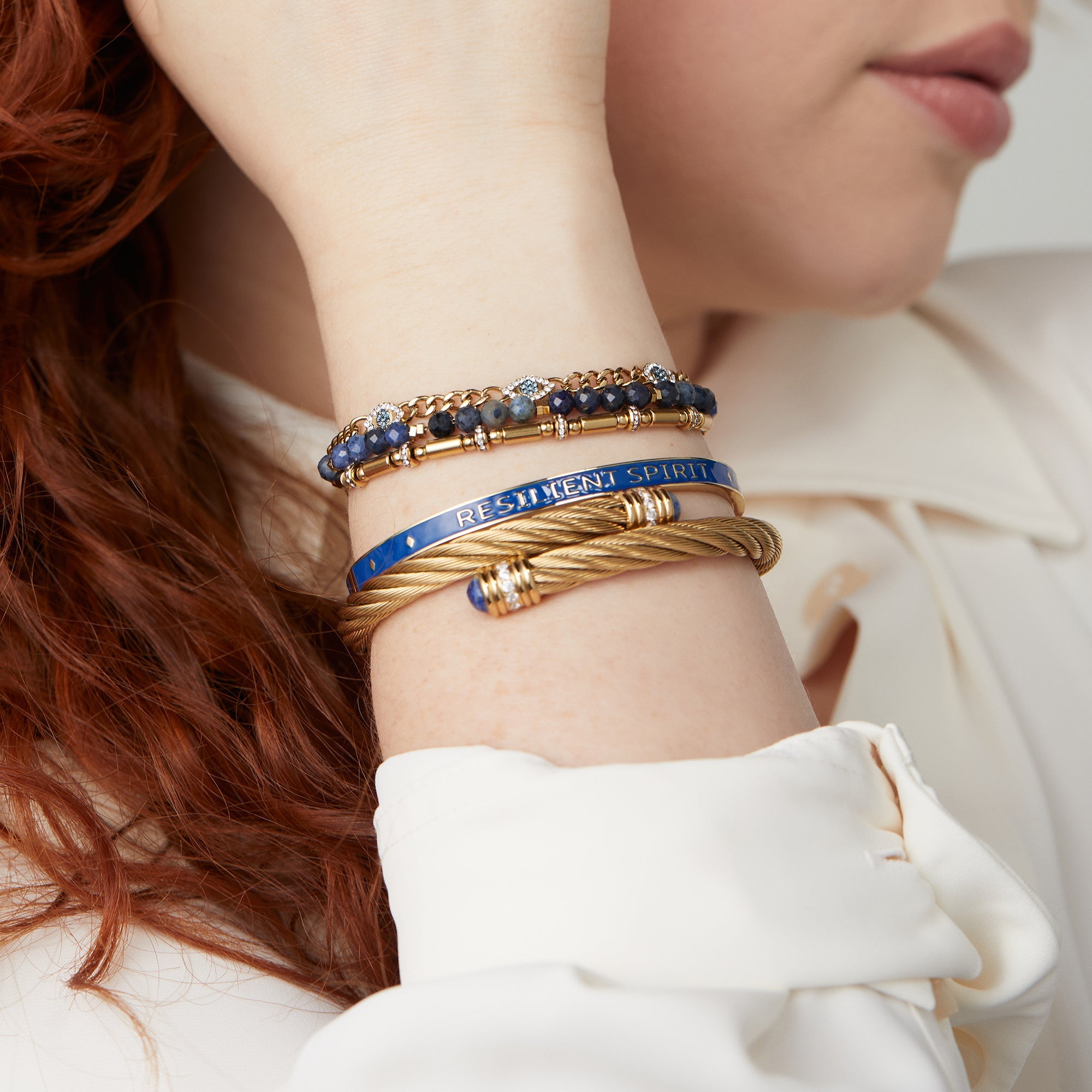 Set of ALEX AND ANI Evil Eye Stranded™ bracelets in stainless steel and gold, featuring protective evil eye charms.