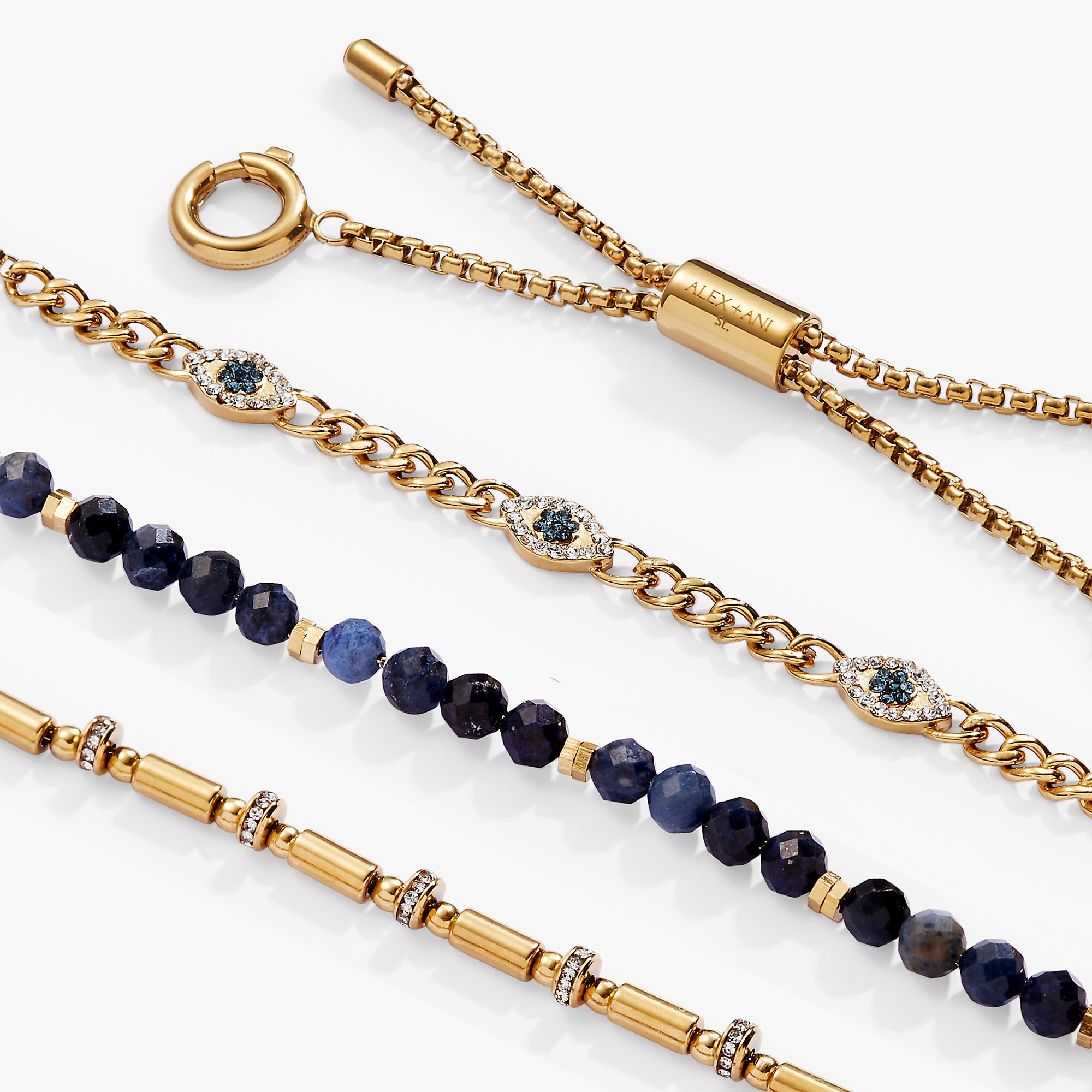 Set of ALEX AND ANI Evil Eye Stranded™ bracelets in stainless steel and gold with eye charm accents, stylish jewelry accessories.